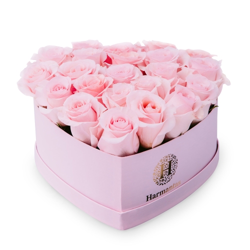 Pink roses in a pink heart-shaped box