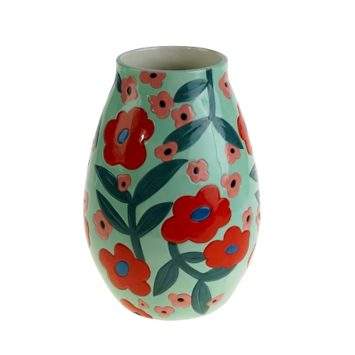 Blue glossy vase with flowers