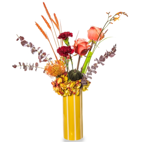 Yellow striped vase with autumn floral arrangement 