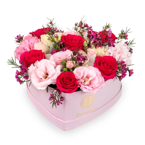Roses and lisianthus in a pink heart box