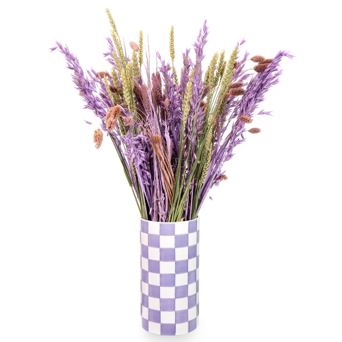 A purple vase with dried grains.