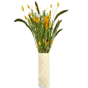 Yellow checkered vase with dried grains