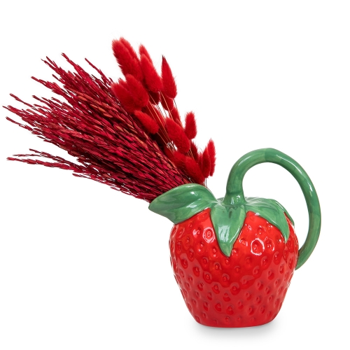 Red dried cereal in strawberry teapot