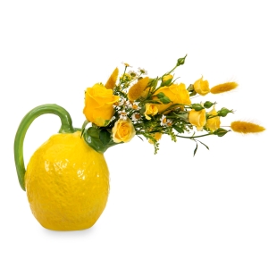 Yellow roses in lemon teapot