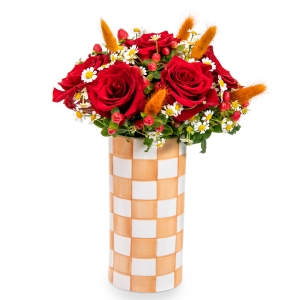 Red roses in orange checkered vase