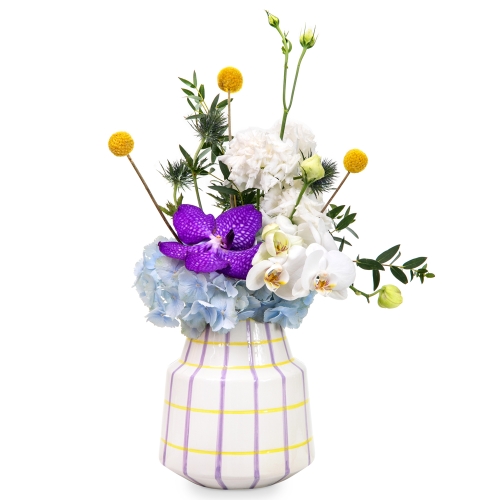 Orchids, lisianthus, and hydrangea in a unique vase.