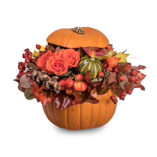 Pumpkin with roses, orchids and autumn leaves