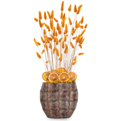 Bunny tails and orange slices in a bronze vase