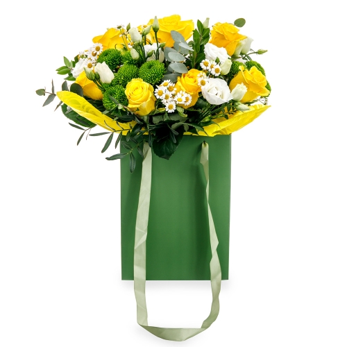 Bouquet with yellow roses in a green bag