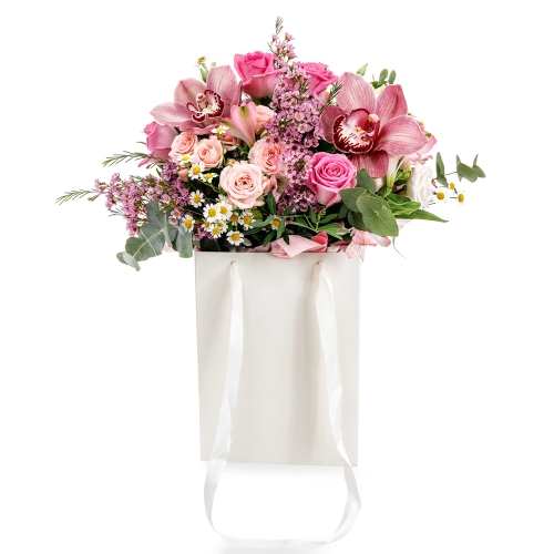 Bouquet in pink shades in a white bag
