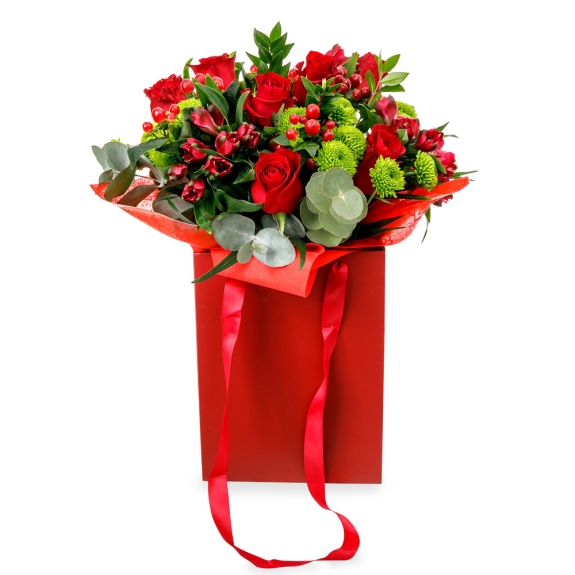Bouquet with red flowers in a red bag