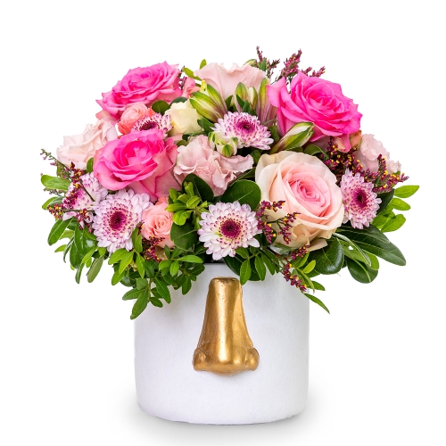 Pink flowers in white vase with gold nose