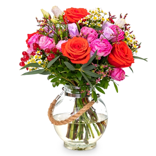 Bouquet of fuchia and orange roses with a vase