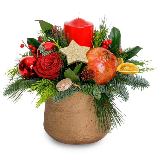 Christmas arrangement in red colors with candle