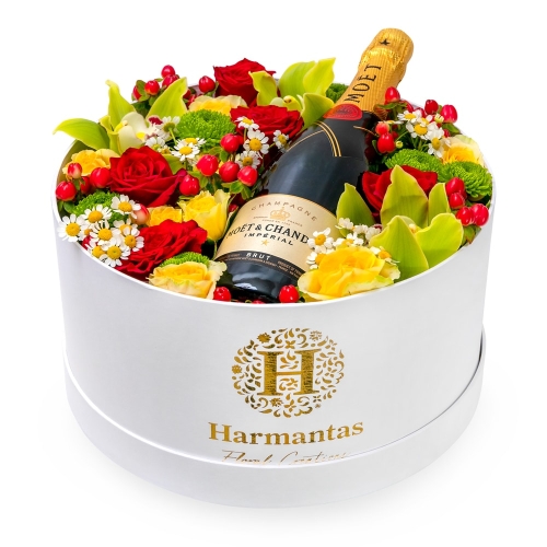 White box with flowers and champagne