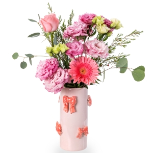 Pink vase with bows and light floral arrangement with gerberas and lysianth