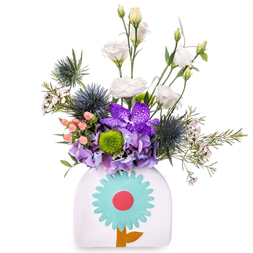 Flower arrangement in a white vase with blue flower