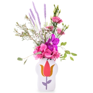 Pink floral arrangement in a white vase with tulip