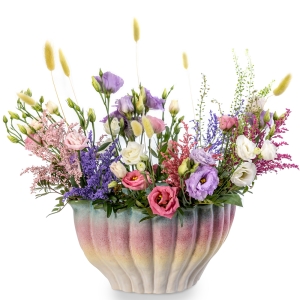 Big coral vase with lisianthus flowers in pink, purple and white
