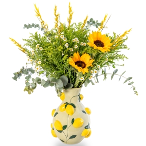 Lemon vase with chamomile and sunflowers