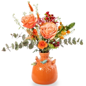 Orange vase with birds and spring flower arrangement