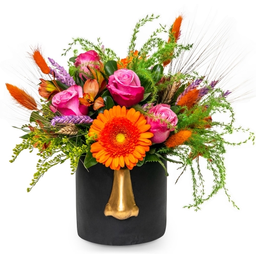 Pink and orange flowers in black face vase