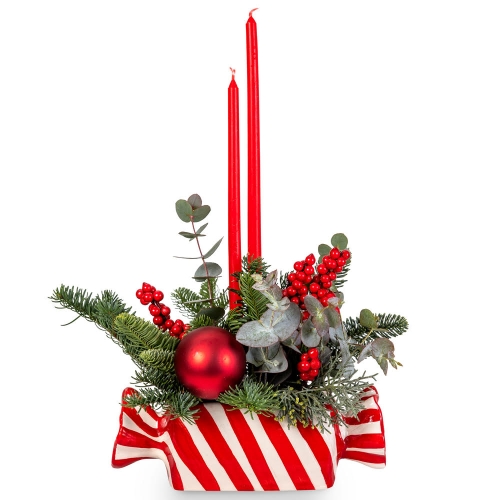 Festive candy with fir, ilex and red candles