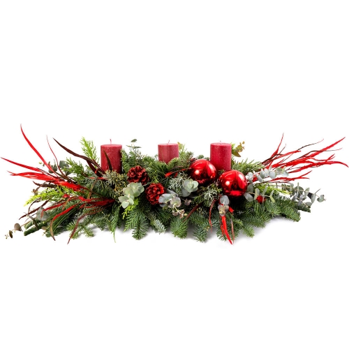 Festive table flower arrangement with three red candles